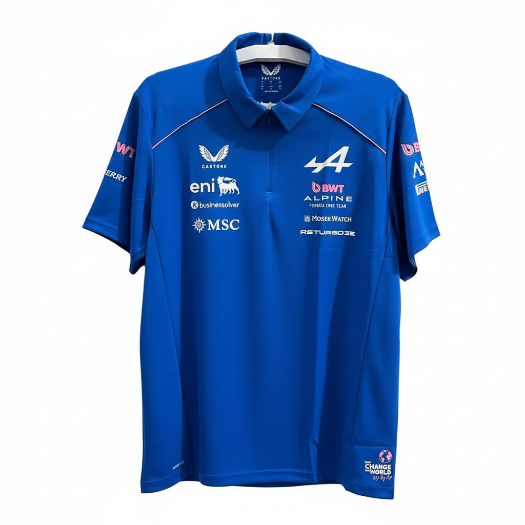 A royal blue short-sleeve polo shirt with multiple sponsor logos and the number 4 on the chest, hanging against a white decorative screen background.
