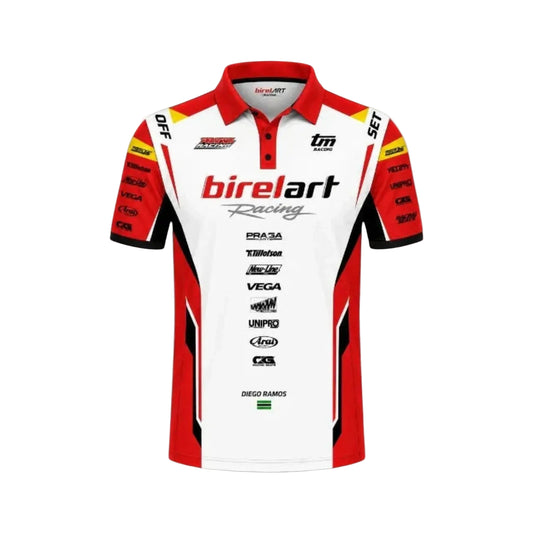 A red and white short-sleeve racing polo shirt with 'birelart Racing' printed across the chest, featuring various sponsor logos on the front and sleeves, set against a white background with a faint watermark.