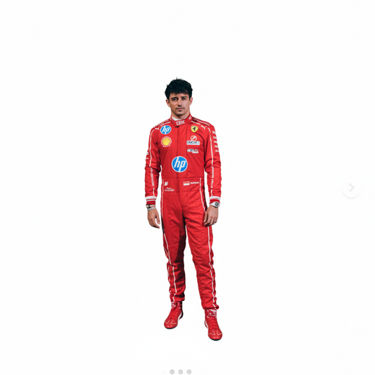 A man wearing a red Ferrari racing suit and matching red boots stands in front of a red wall, with red-covered Formula 1 cars on either side.