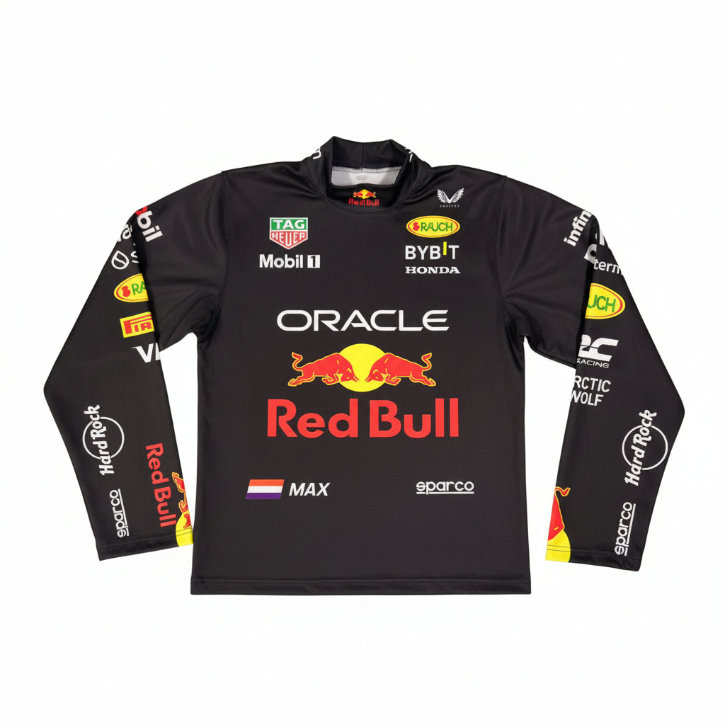 A black Oracle Red Bull Racing long-sleeve performance jersey laid flat on a gray tiled floor. The jersey features the prominent red Bull logo in the center, with sponsor logos such as TAG Heuer, Mobil 1, Bybit, and Honda, and player name MAX printed on the front.