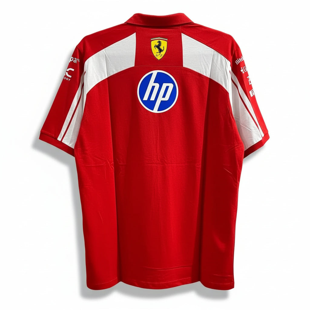 A red and white short-sleeve Ferrari team jersey with HP and Scuderia Ferrari logos, displayed against a decorative white and black patterned wall.