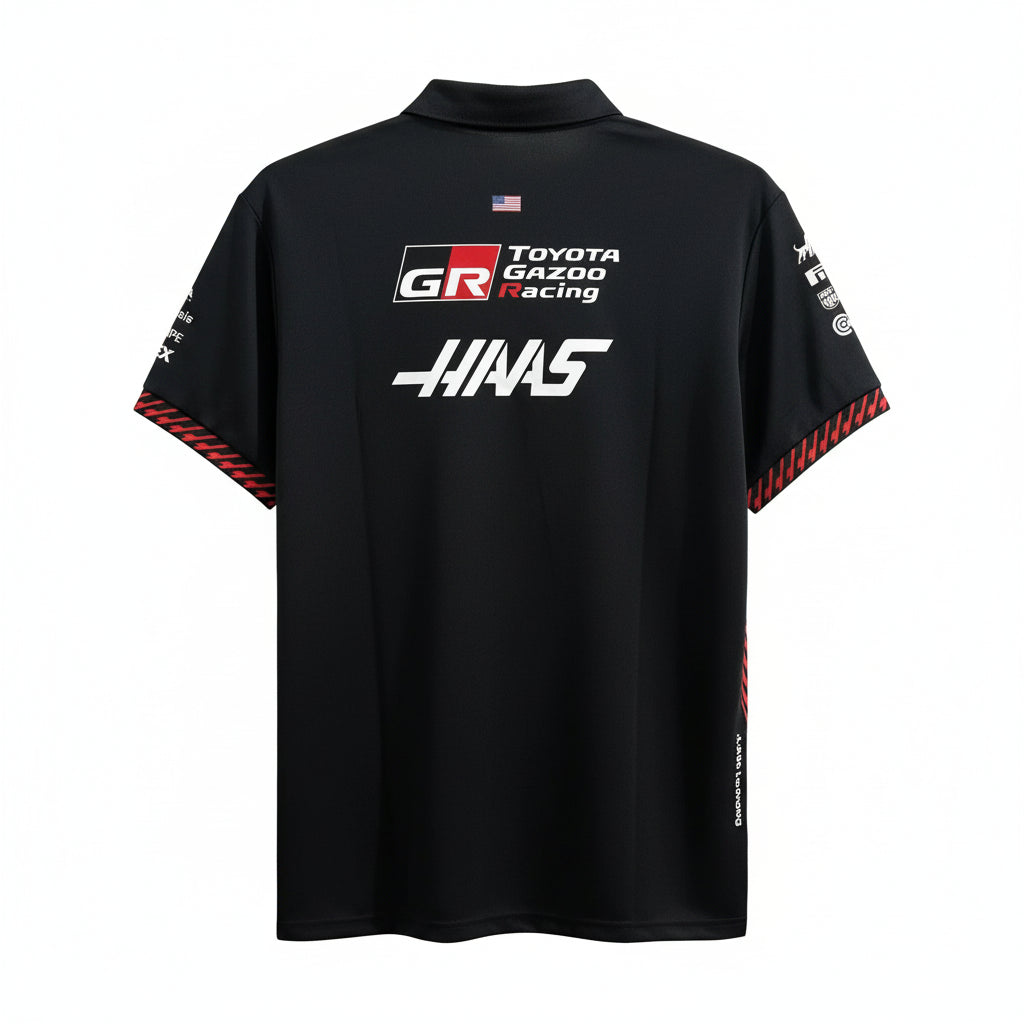 A black short-sleeve polo shirt featuring Toyota Gazoo Racing -HIAS branding on the back, displayed against a white decorative screen.